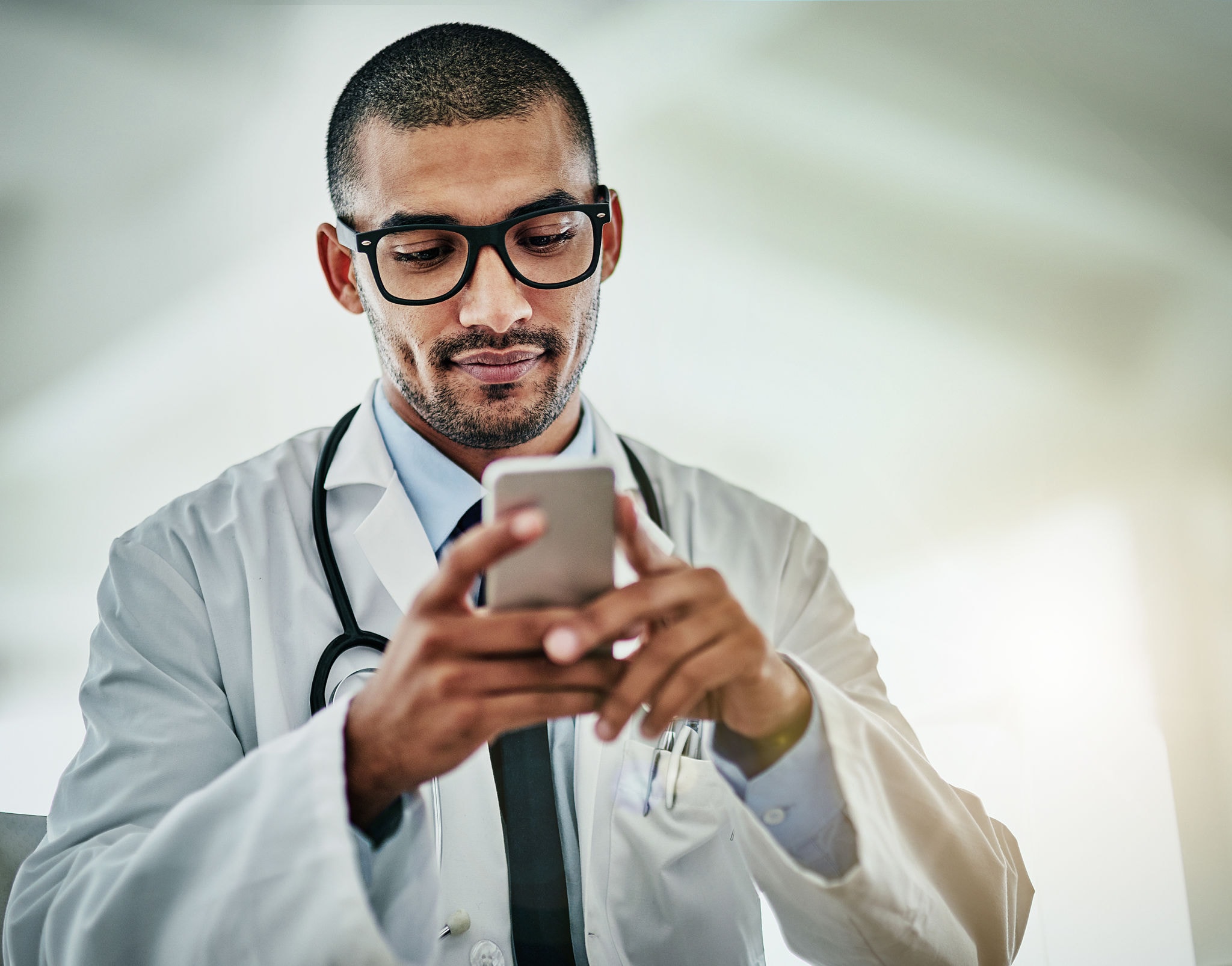 Doctor using chat app on smartphone